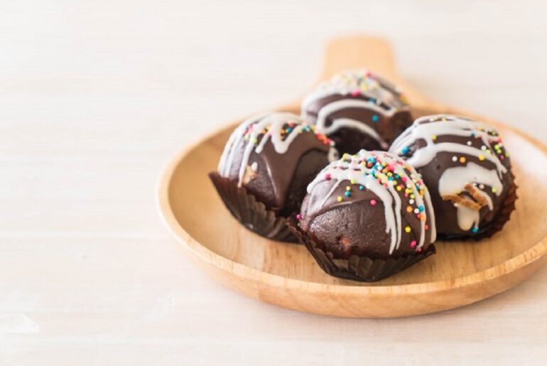 Malt balls- Take a trip down memory lane Malt balls get their name from the malt in their centers covered by a white chocolate shell, with the whole thing dipped in milk chocolate.