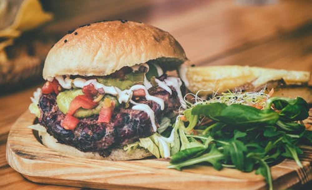 What is an olive burger?? Well, it's unique, where the beef patty is topped with chopped or sliced olives and olive juice